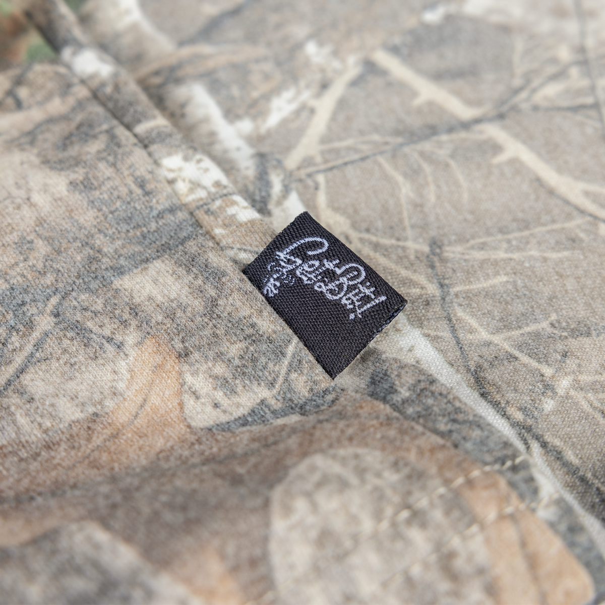 Closeup of woven label with "Get Bit!" text