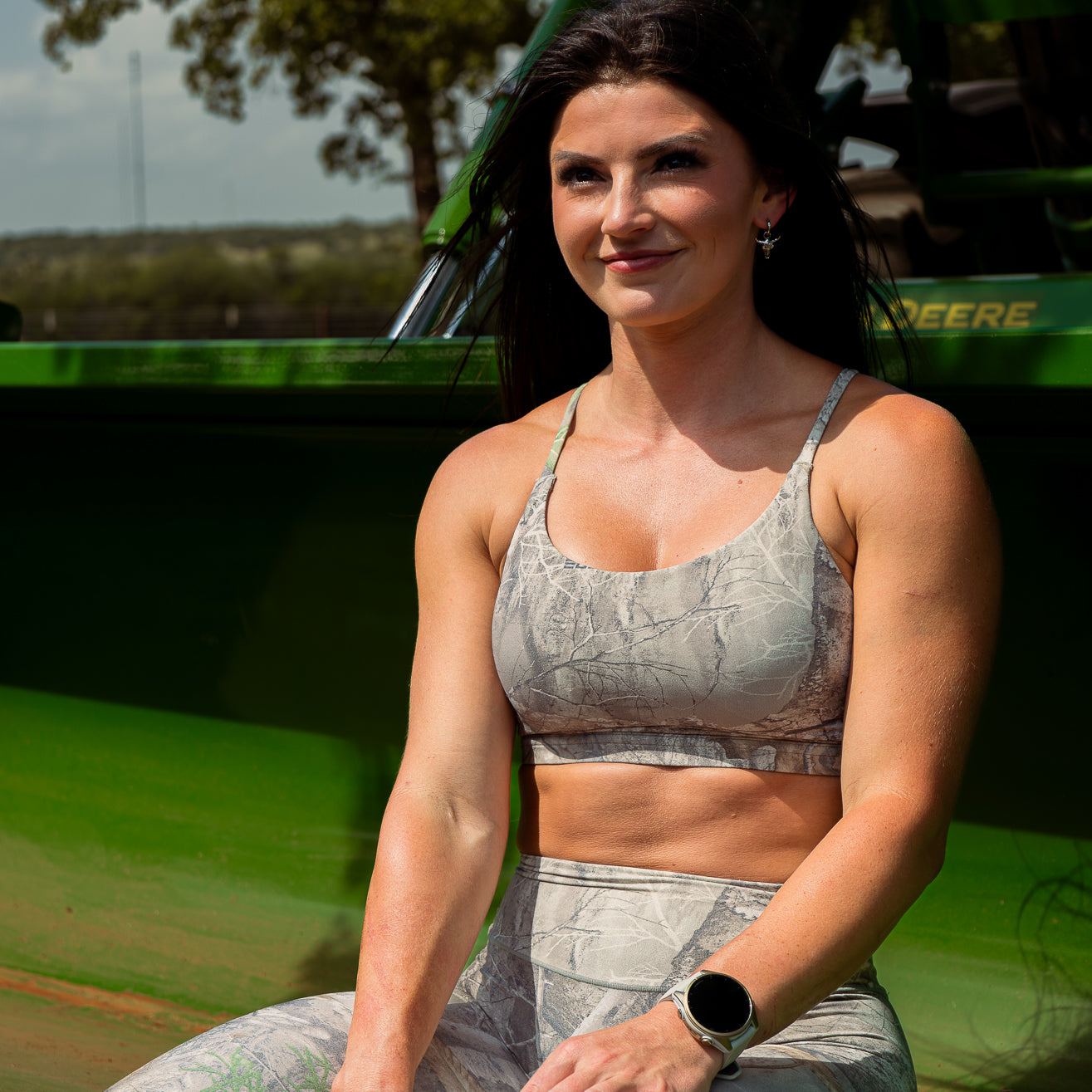 Woman wearing Camo Sports Bra and leggings