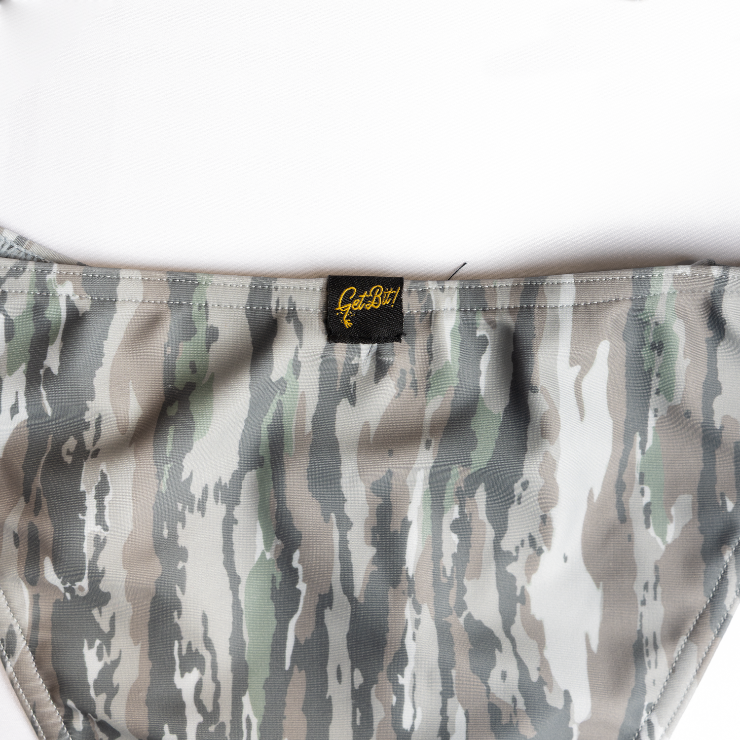 closeup of "Get Bit!" label on camo bikini
