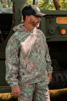 man in camo gear and Black "Get Bit!" hat