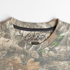Neck of camo shirt with "Get Bit!" logo on interior