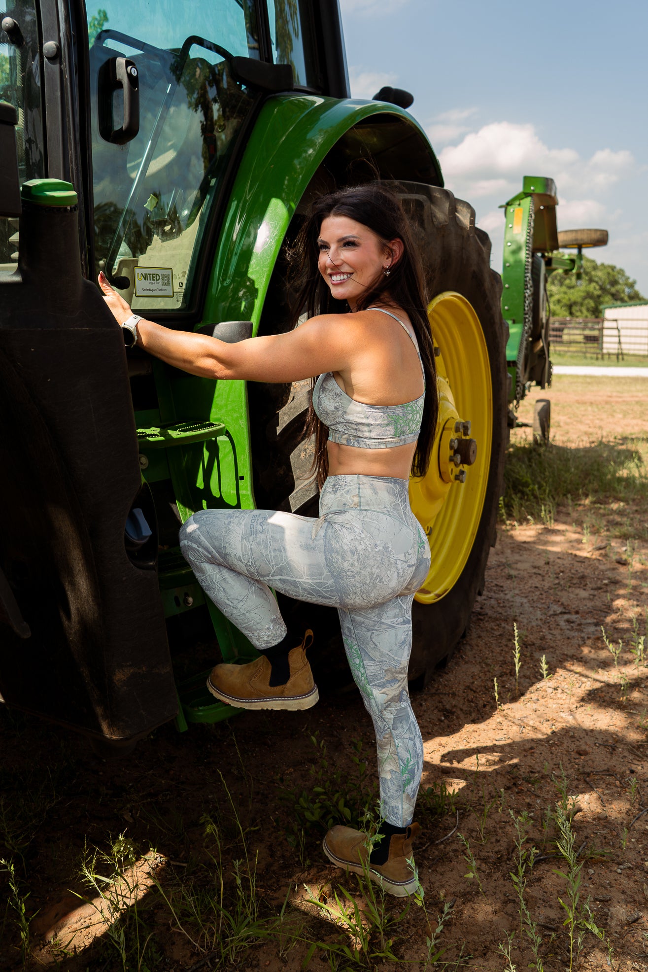 Woman wearing camo leggings and sports bra