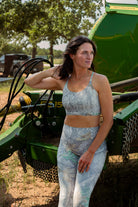 Woman wearing Camo Sports Bra and leggings