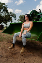 Woman wearing Camo Sports Bra and leggings