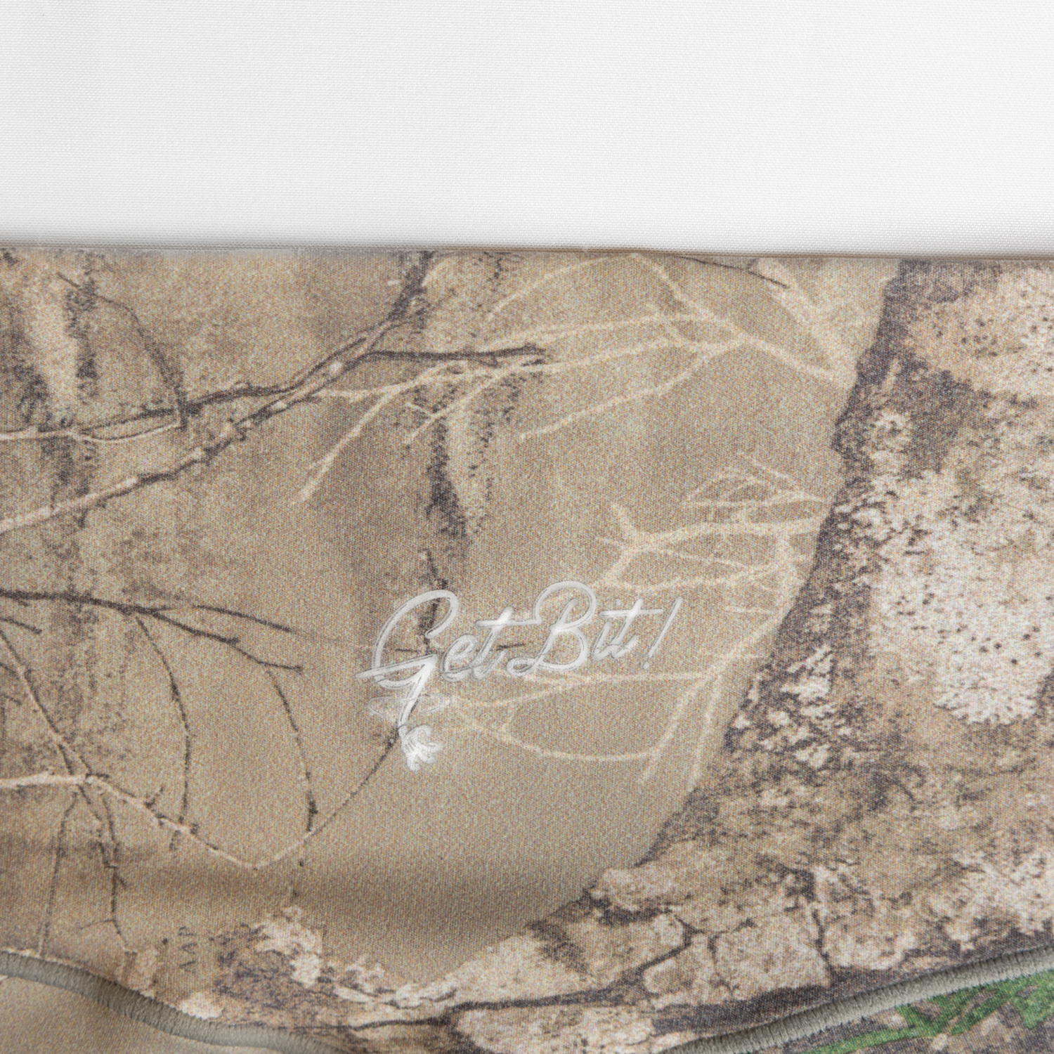 Closeup of "Get Bit!" logo on camo leggings