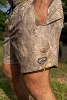 "Get Bit" logo patch on camo swim trunks