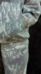 Camouflage sweatpants on a white background showing "GET BIT" text